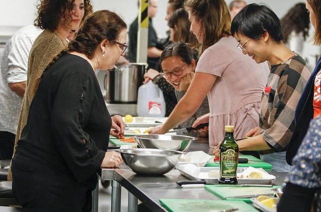 Kleiman supervising event attendees at What’s on the Plate? The Sustainability of Social Enterprises. This was the last event in the ten-week Off the Table series.