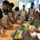Students prepare a meal at the teaching kitchen.
