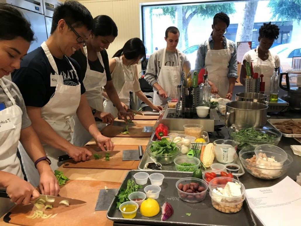 Students prepare a meal at the teaching kitchen.