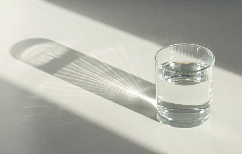 A glass cup filled with water