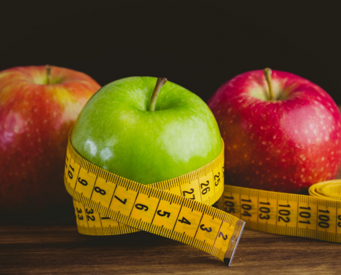 apples with measuring tape